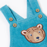 A close up of the Frugi durgan cord dungarees in boat blue showing the button fastener detail