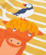 Frugi kids easy on top showing close up of a highland cow applique on yellow and white striped organic cotton fabric