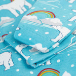 A close up of the scratch mitts which fold over the wrist cuffs on the Frugi Easy Dressing Babygrow - Winter Tails. The image also shows the Winter Tails, Polar Bear print on the babygrow