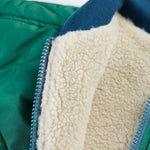 A look at the fleece and zipper on the Frugi Robin Reversible Quilted Jacket - Teal/Moon