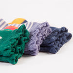 A close up view of the frills on the Frugi Freya Frilled Socks 3 Pack - Rainforest Friends