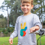 A child wearing the Frugi Owen Top - Grey Marl/Peace