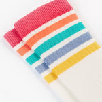 A closer look at the rainbow stripes on the Frugi Hygge Rib Knee Socks - Soft White Rainbow, in red, orange, green, blue and yellow