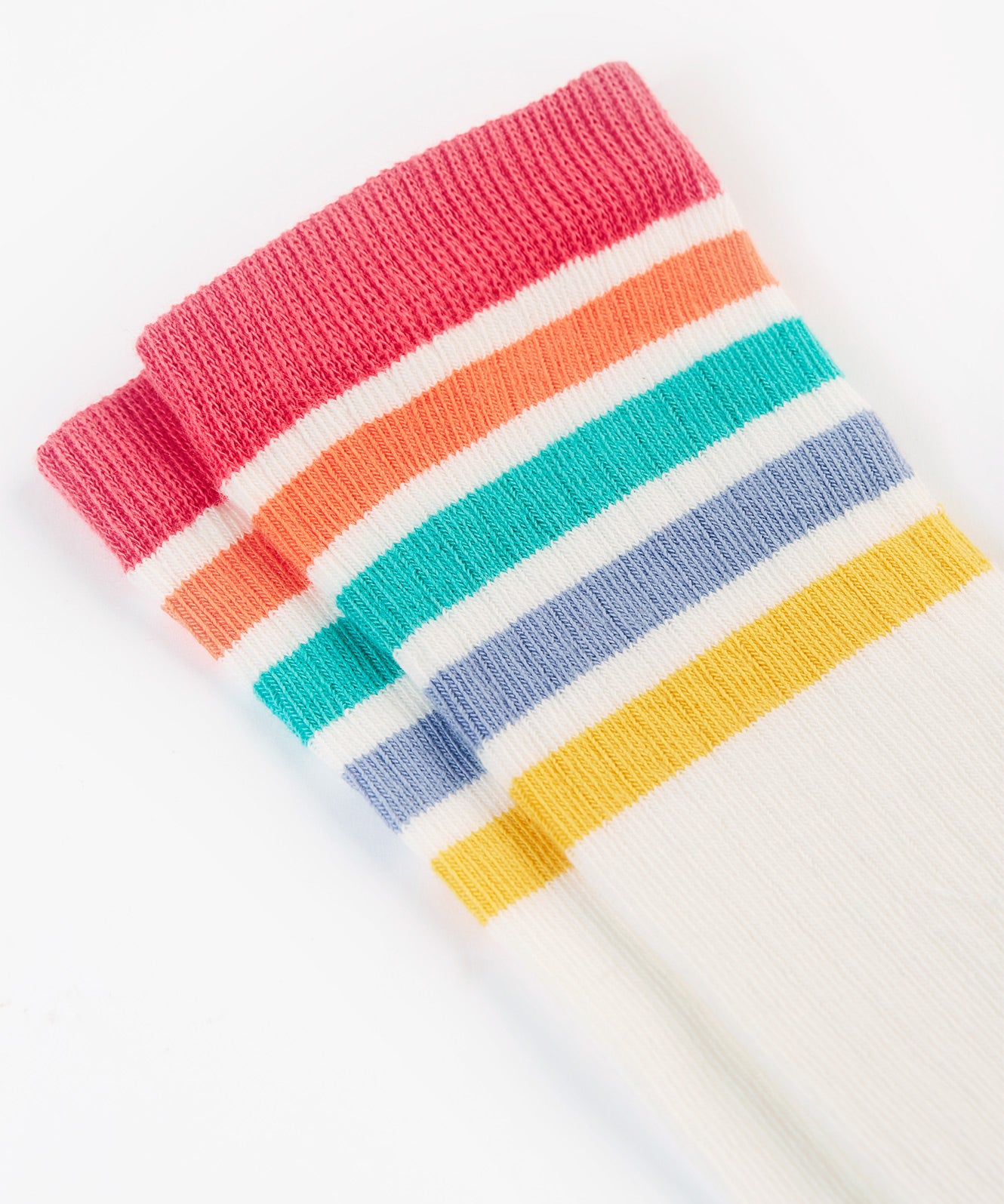 A closer look at the rainbow stripes on the Frugi Hygge Rib Knee Socks - Soft White Rainbow, in red, orange, green, blue and yellow