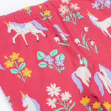 A close up of the Frugi libby leggings in rose uncicorn/floral available at Babipur showing the elasticated waist band detail