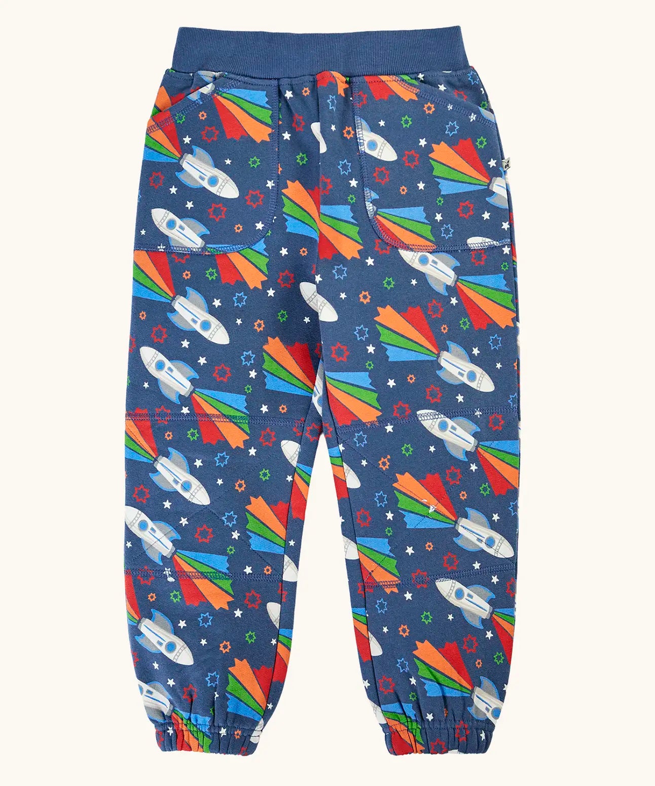 Frugi GOTS 100% organic cotton navy joggers with repeating space adventure rocket print with elasticated cuffs and waist band and side pockets