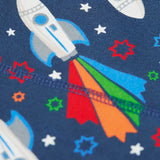 Frugi GOTS 100% organic cotton navy joggers showing a close up of the  repeating space adventure rocket print 