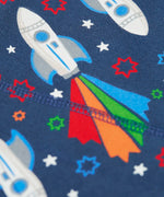 Frugi GOTS 100% organic cotton navy joggers showing a close up of the  repeating space adventure rocket print 