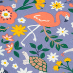 A closer look at the animal and plant/leaf print on the Frugi Sofia Skater Dress - Rainforest Friends. The image shows a flamingo stood on one leg, a turtle, the top of a zebra, and colourful flower and leaves
