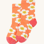 The orange sock with white flowers from the Frugi Rock My Socks - Stay Wild 3 Pack