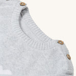 A look at the buttons on the neck and shoulders of the Frugi Kiera Knitted Dress - Grey Marl/Giraffe