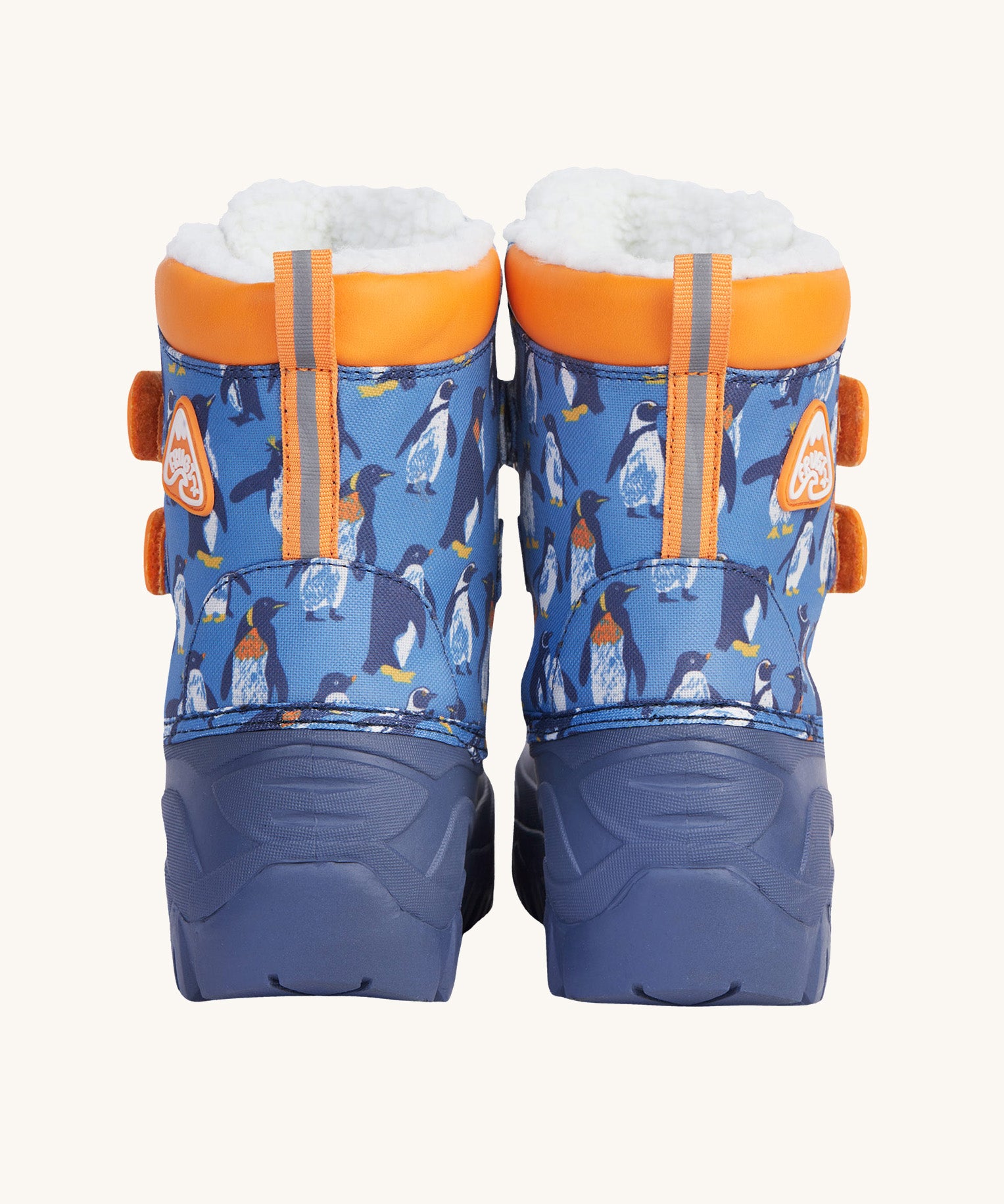 A close up of the Frugi out and about snow boots in penguin waddle showing the orange trim and deep blue sole detail