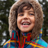 Small child wearing Frugi's Penhale tartan parka coat showing close up of fur brim around the hood