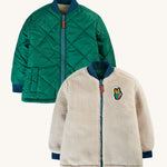 Frugi Robin Reversible Quilted Jacket - Teal/Moon. A padded green jacket with a soft fleece lining which is fully reversible
