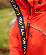 Child wearing the Frugi kids 3 in 1 rambler coat in fire upon a star showing the full length zip and popper fasteners