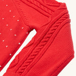 A closer look at the cable knit sleeve detail on the Caleb Character Knit Jumper - True Red/Penguin