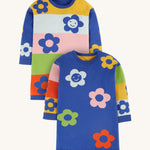 Frugi Zola Reversible Knitted Dress - Blue Tang/Retro Floral. A beautiful knitted, long sleeve dress with a gorgeous retro colour-block fabric and floral patterns. The image shows the dress with colour-block body and blue sleeves, and the reverse with a blue body and colour-block sleeves. Both sides have bold, colourful floral prints.