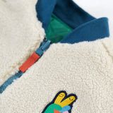 A closer look at the fleece side of the Frugi Robin Reversible Quilted Jacket - Teal/Moon