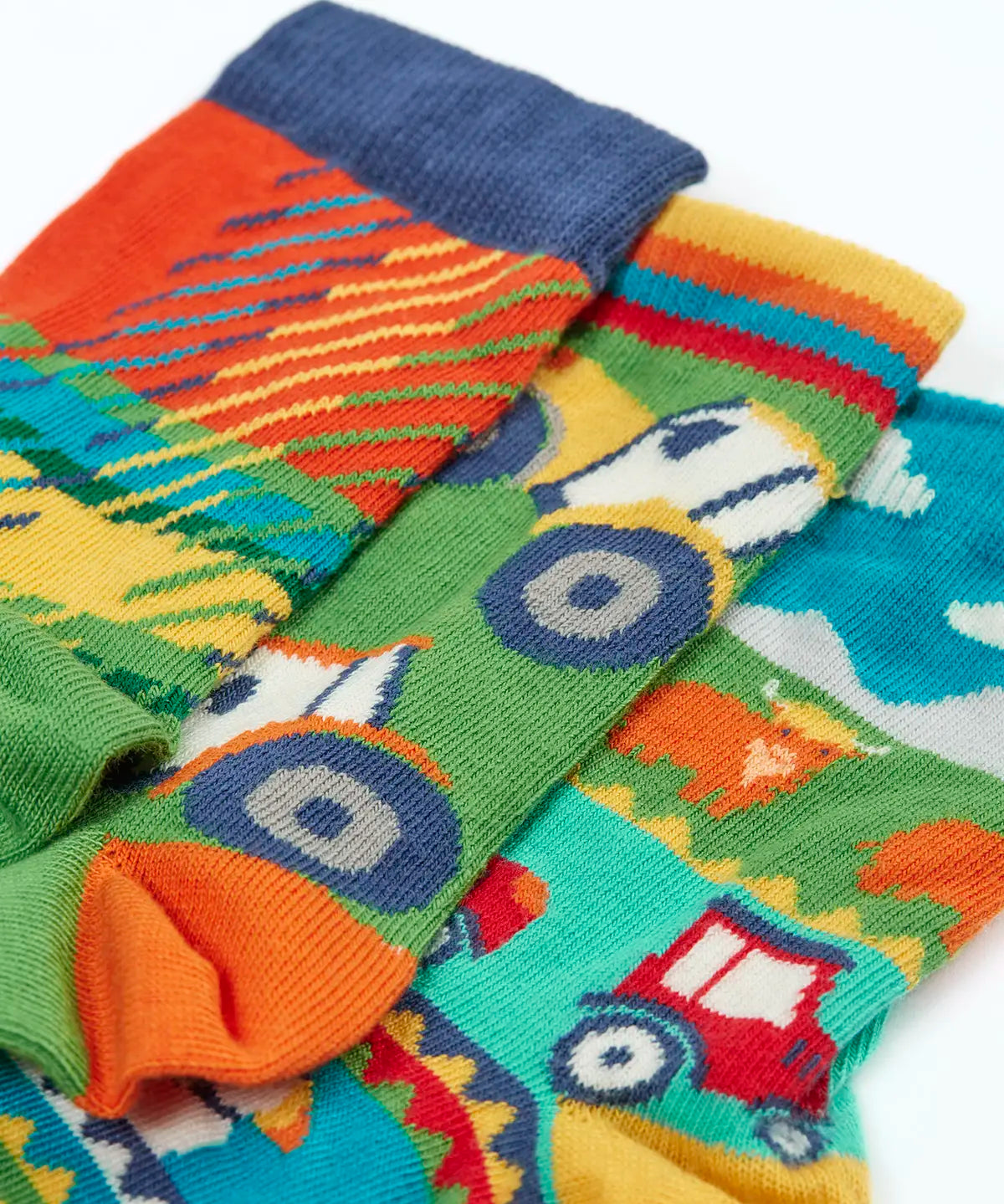 Frugi GOTS 100% organic cotton 3 pack socks including tartan, tractor and Scottish farm themes showing their comfy ribbed cuffs 