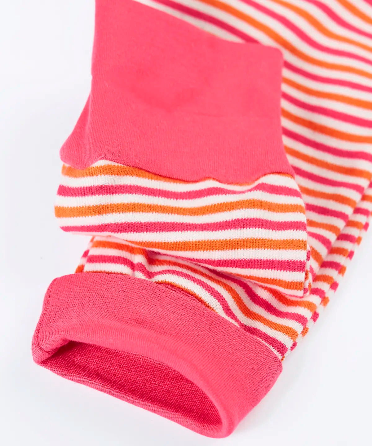 Frugi GOTS 100% organic cotton kids romper in pink and white stripes showing a close up of the fold up cuffs for extender wear