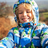 Child wearing the Frugi recycled polyester snow and ski coat in starry slopes with the hood up 