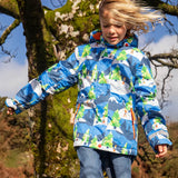 Child wearing the Frugi recycled polyester snow and ski coat in starry slopes 