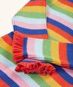 A closer look at the lovely ruffled wrist cuffs on the Frugi Zoe Knitted Jumper - Retro Stripe. The image also shows the bright and bold colour-block fabric