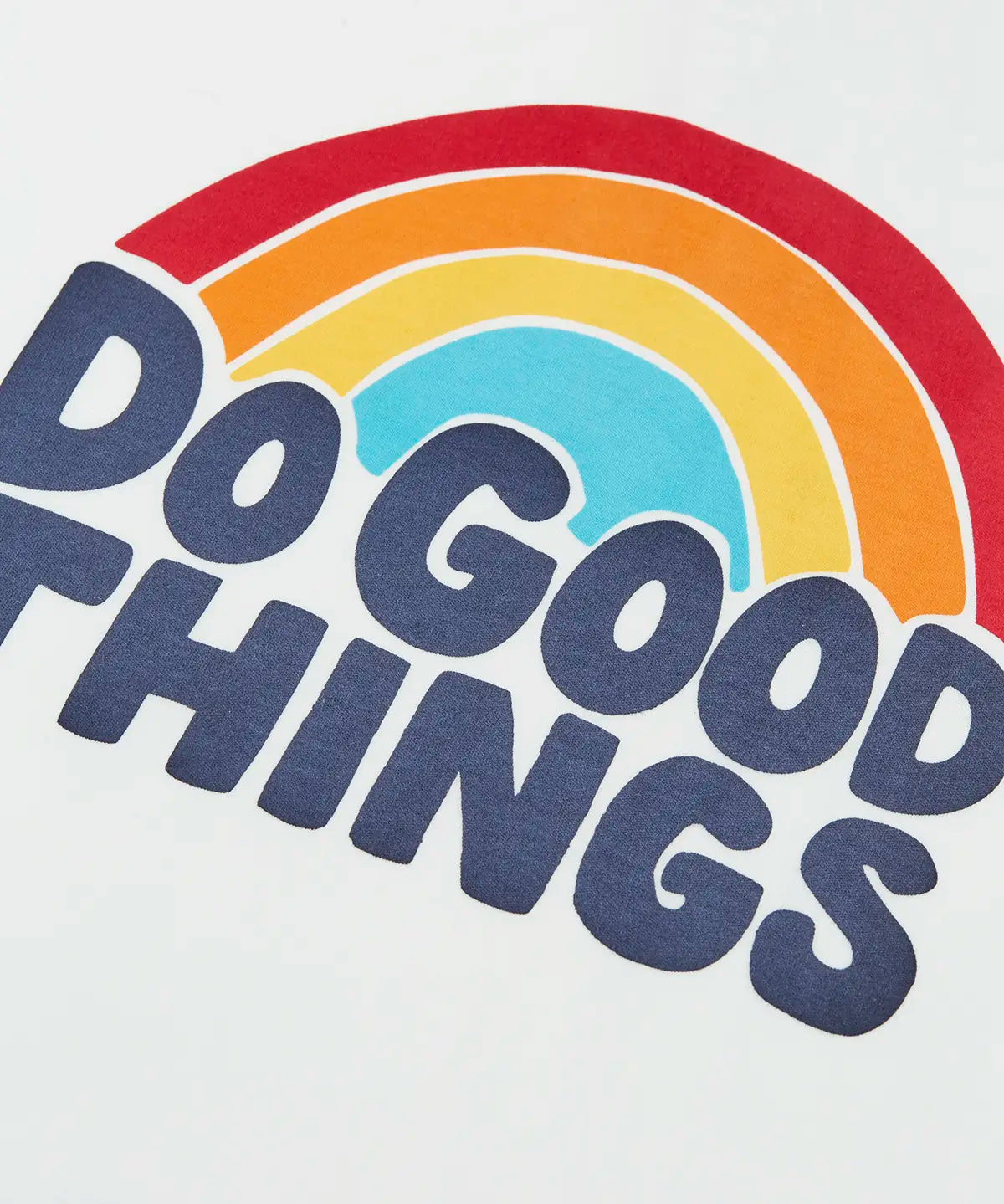 Frugi raglan kids top showing a close up of the do good things rainbow slogan graphic on white organic cotton fabric