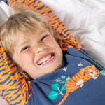 A child wearing the Frugi Jamie Jim Jams - Sleeping Tiger