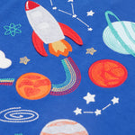 A closer look at the rocket and planet applique details on the Frugi Little Creature Applique Top - Blue Tang/Rocket. which includes embroidered space details