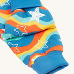 A closer look at the ribbed ankle cuffs on the Frugi Cosy Parsnip Pants - Wavy Stars/Protect Your Planet.