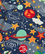 Frugi navy kimono style babygrow showing a close up of the repeating playful outer space print navy organic cotton fabric