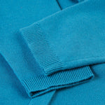 A closer look at the soft knit, blue  sleeves on the Frugi Romi Ruffle Cardigan - Deep Water/Fairies