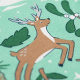 A close up of the reindeer design on the Frugi libby leggings in festive forest available at Babipur. 