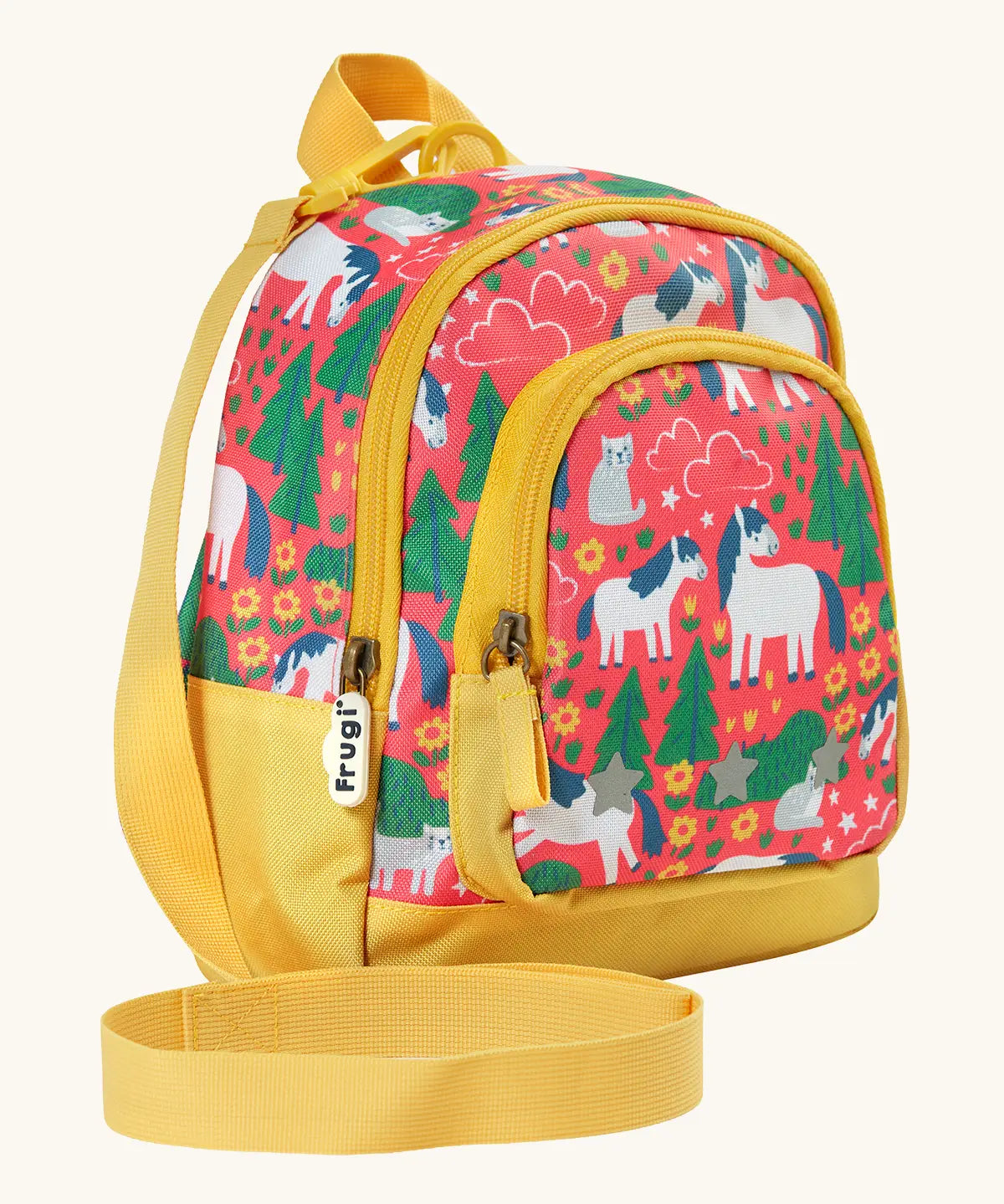 Side of Frugi Shetland skip little adventures backpack. Showing a handy rein attached to the handle and yellow zip details