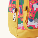Frugi Shetland skip little adventures backpack showing a close up of the repeating Shetland pony, trees and cat design and yellow zip detail