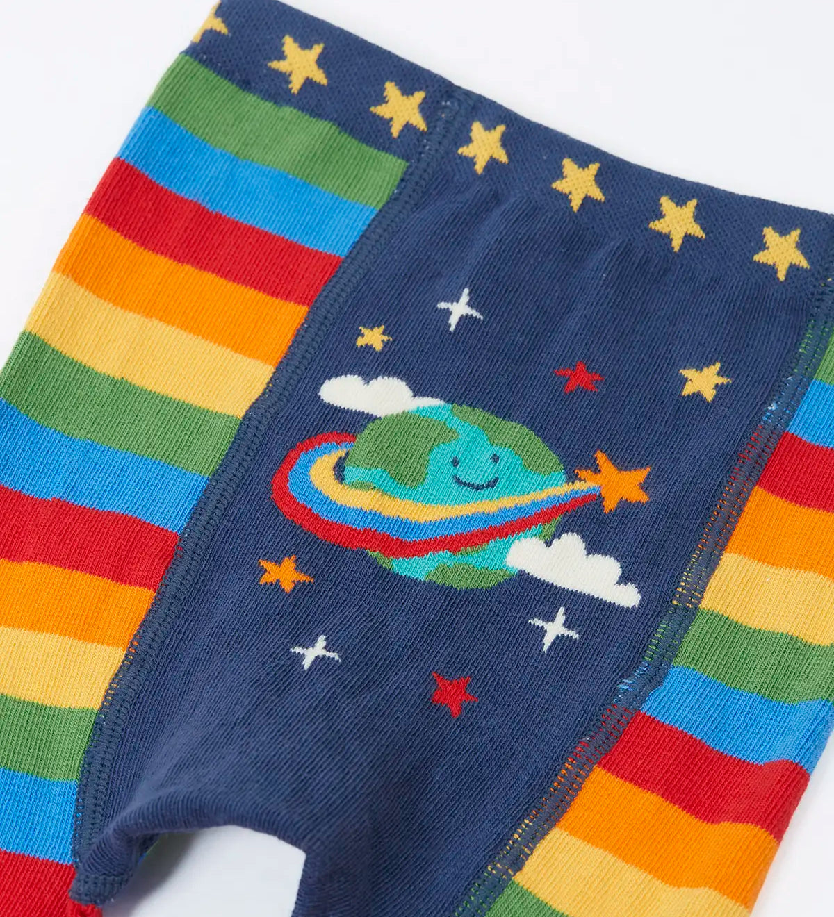 Frugi rainbow striped  knitted leggings laid flat showing the cute planet earth on the back on organic cotton fabric