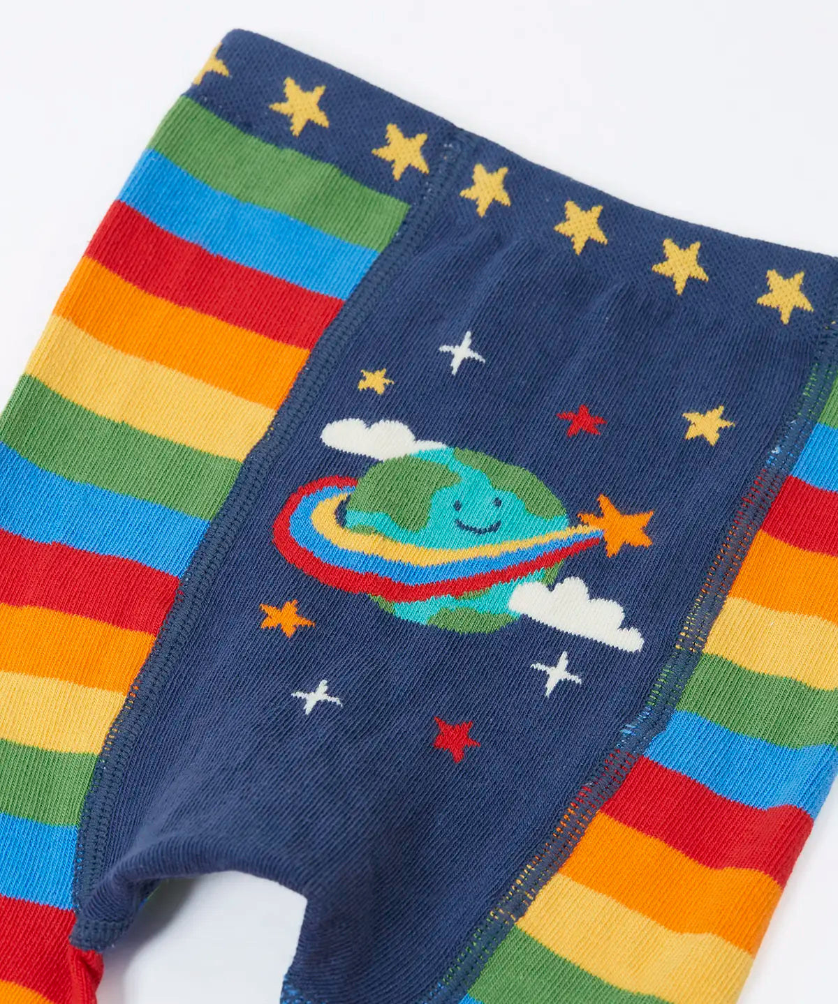 Frugi rainbow striped  knitted leggings laid flat showing the cute planet earth on the back on organic cotton fabric