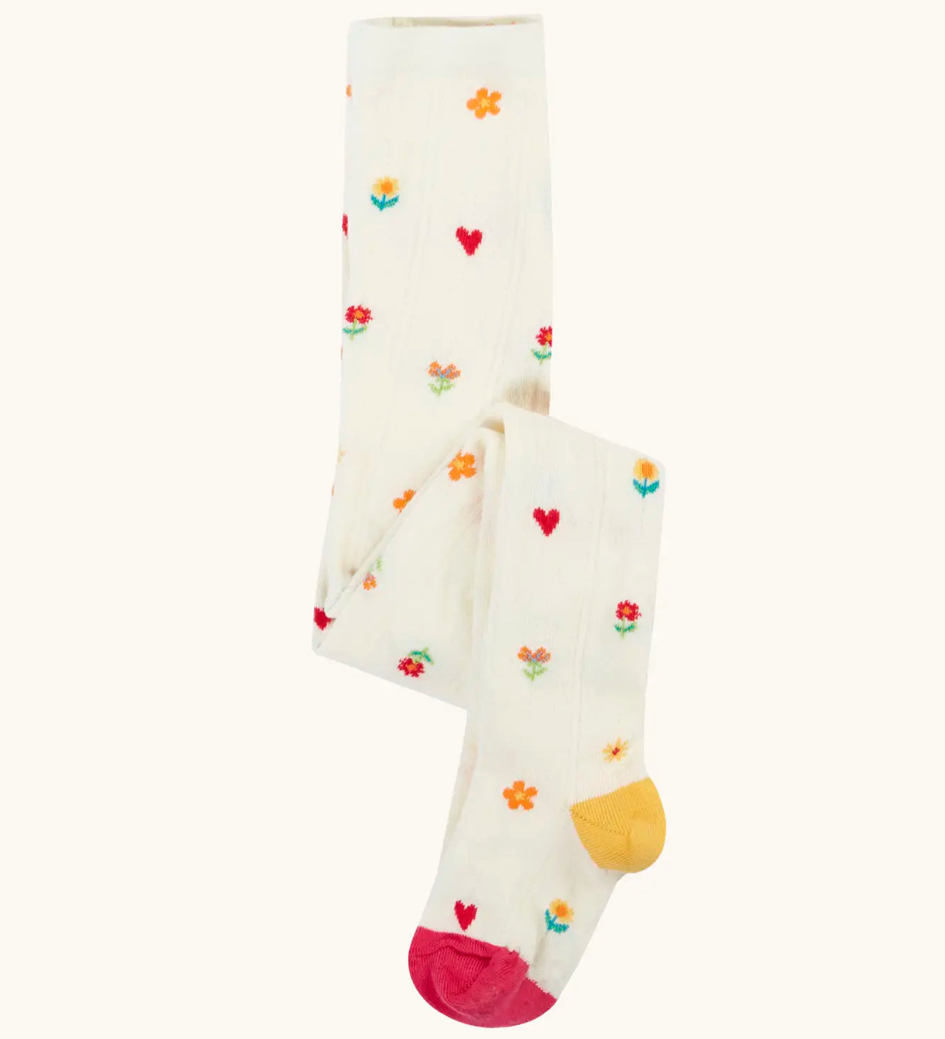 Frugi GOTS organic cotton little pointelle kids tights in soft white with a repeating floral and heart design. Features a pink toe and yellow heel 