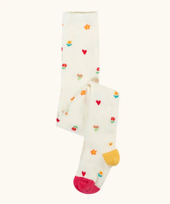 Frugi GOTS organic cotton little pointelle kids tights in soft white with a repeating floral and heart design. Features a pink toe and yellow heel 