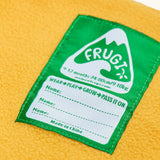 Frugi little waterproof dungarees showing yellow fleece inner and name tag