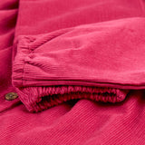 A closer look at the sleeves and wrist cuffs on the Frugi Coco Cord Dress - Lingonberry/Squirrel