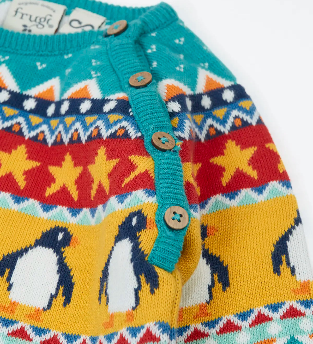 Frugi organic cotton knitted rompersuit in light blue with a winter themed fairisle design on the upper half. showing close up of the shoulder buttons for easy dressing