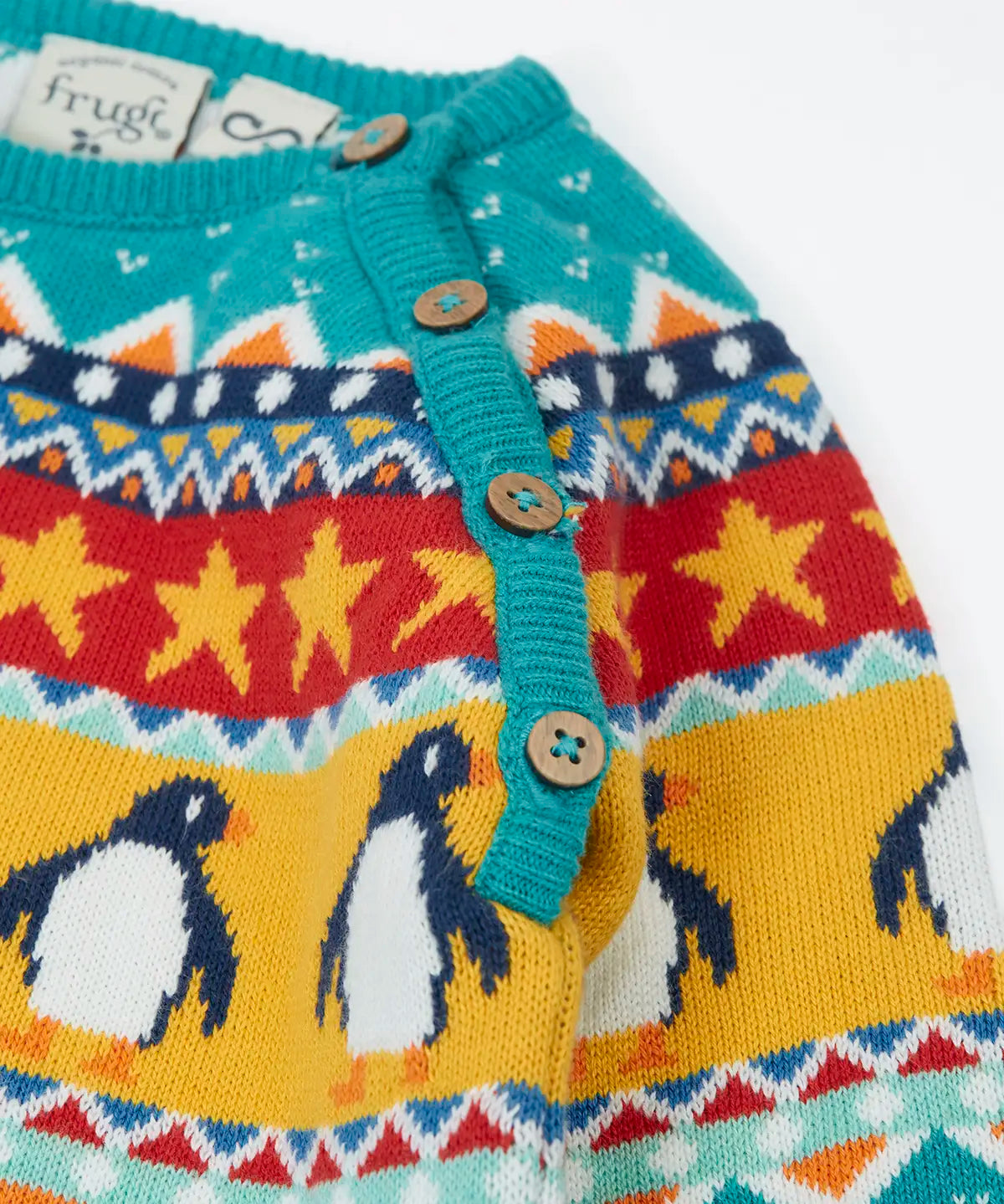 Frugi organic cotton knitted rompersuit in light blue with a winter themed fairisle design on the upper half. showing close up of the shoulder buttons for easy dressing