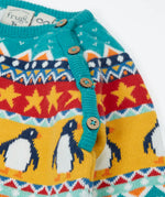 Frugi organic cotton knitted rompersuit in light blue with a winter themed fairisle design on the upper half. showing close up of the shoulder buttons for easy dressing