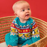 Baby wearing the Frugi GOTS 100% organic cotton knitted rompersuit in blue with a winter themed fairisle design on the upper half. Features elasticated cuffs and shoulder buttons for easy dressing.