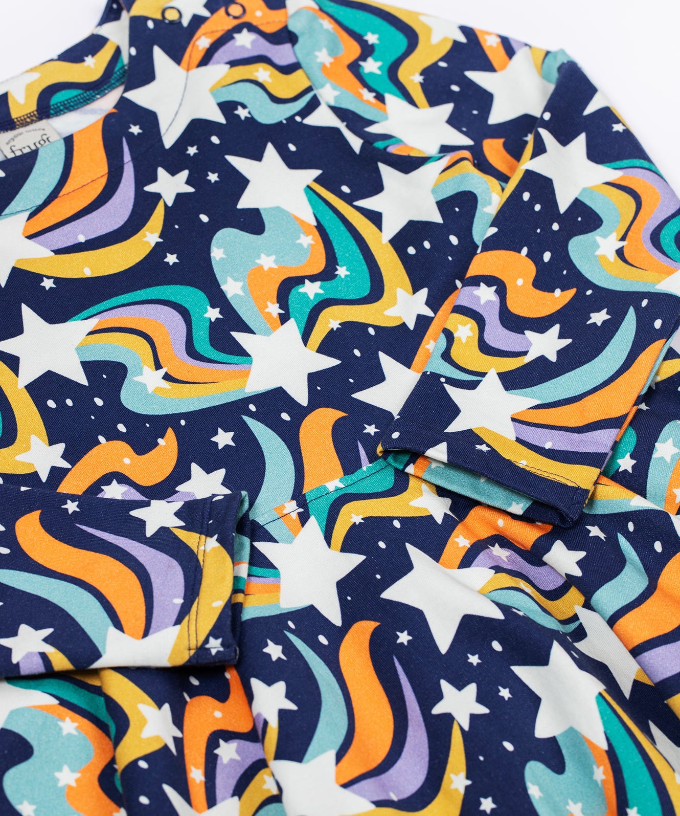 a close up of the Frugi Magic Skies Organic Cotton Cosy Skater Dress. This party dress is a part of a wide range of organic cotton clothing for children available here at Babipur. 