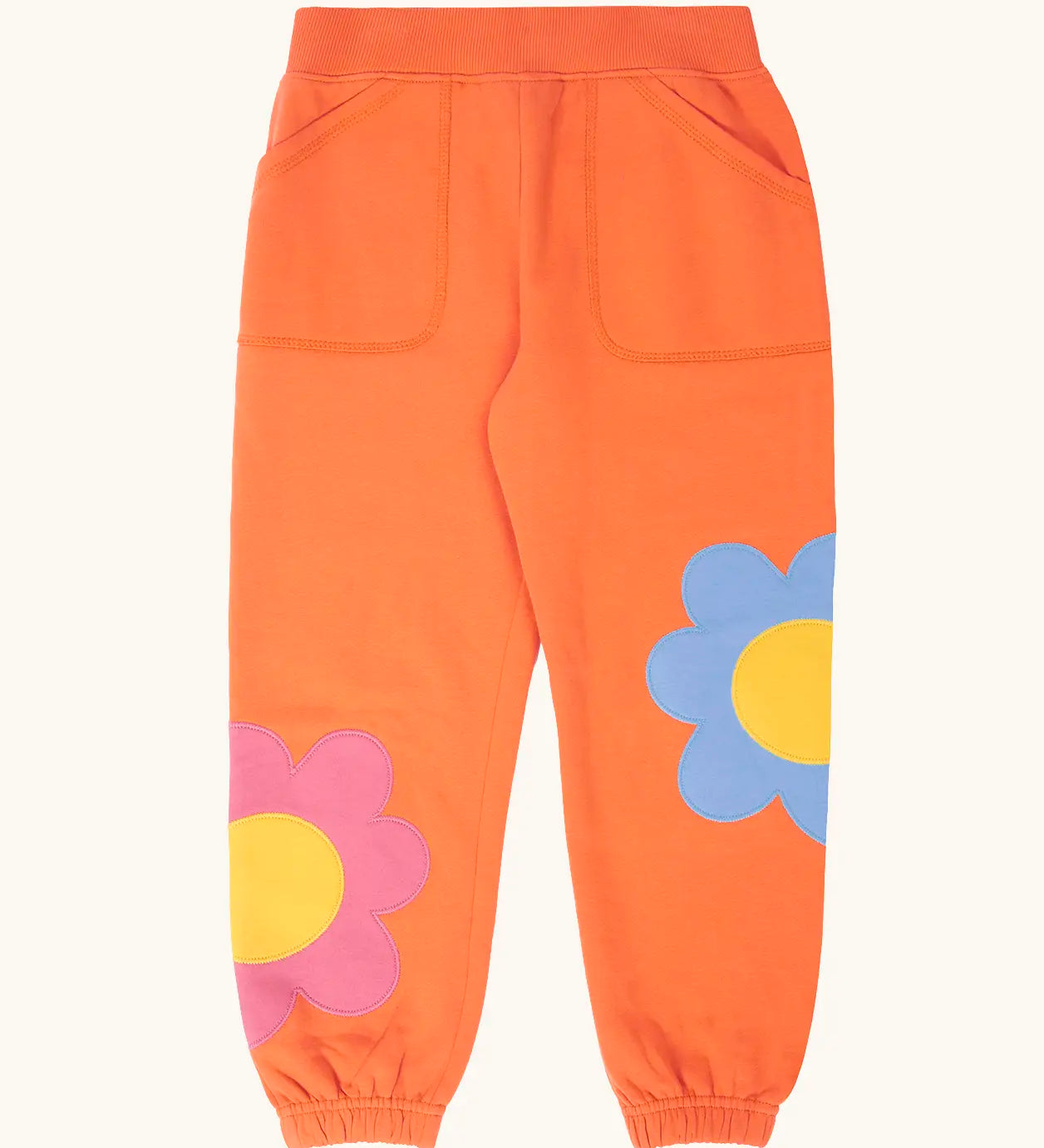 Frugi GOTS 100% organic cotton salamander orange organic joggers with flower appliques on the lower leg and side pockets