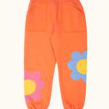 Frugi GOTS 100% organic cotton salamander orange organic joggers with flower appliques on the lower leg and side pockets