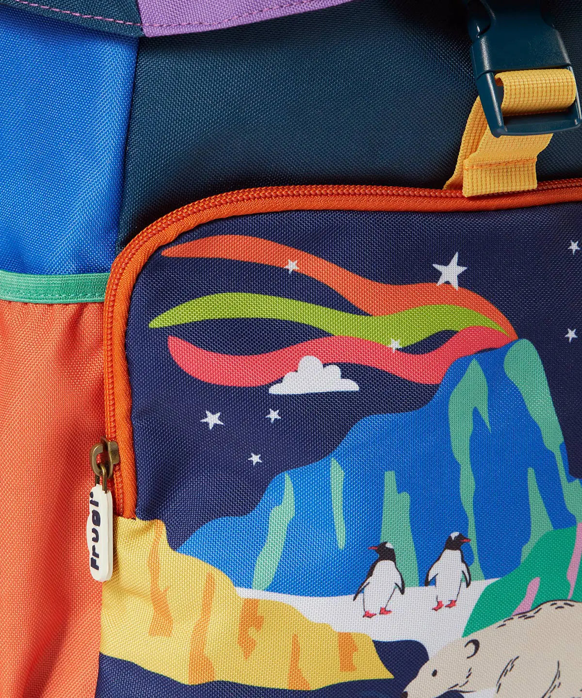 Frugi navigator hotchpotch snow scene backpack showing the front compartment with a winter scene design